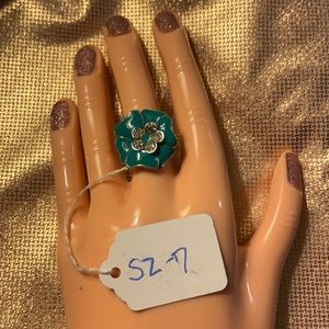 Teal enameled flower ring with clear crystals inside flower. Size 7